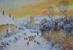 A shepherd and his flock on a snowy village lane