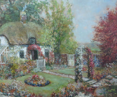 A thatched cottage amid summer blooms